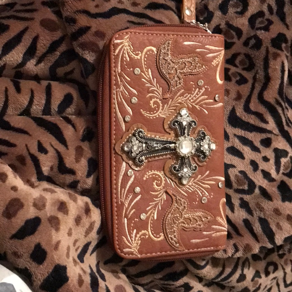 Chic brown cross bling wristlet/clutch.